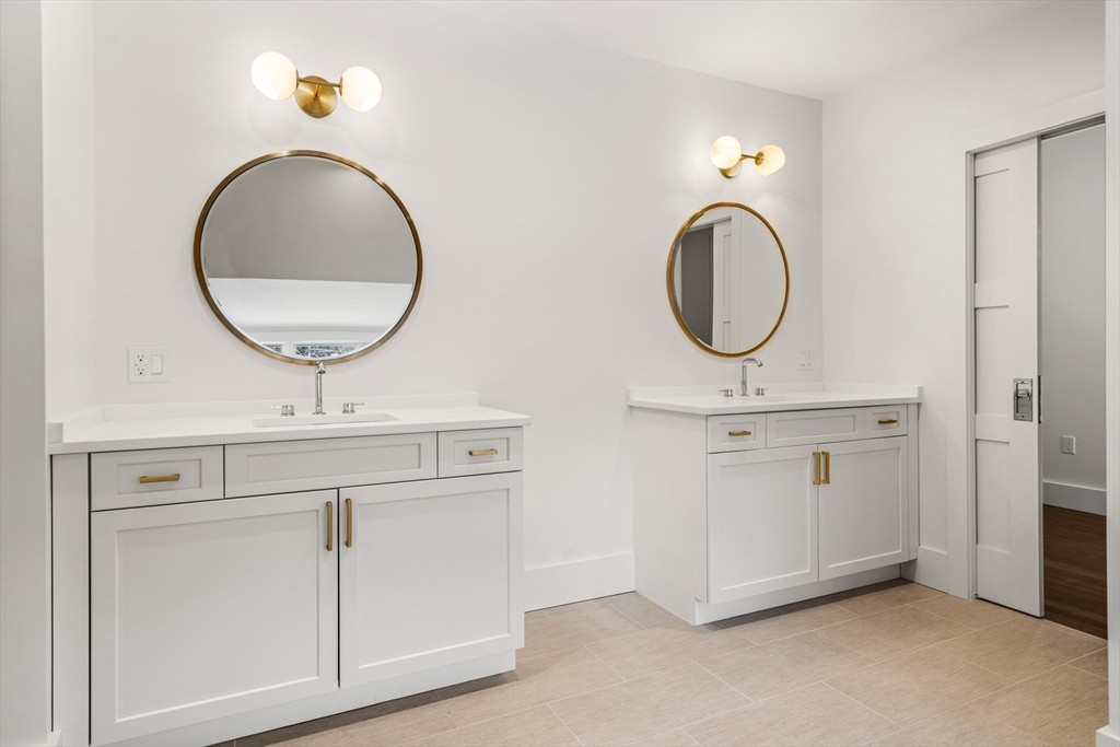 123 Abbott Road Wellesley, MA 02481 - Photo 32 of 42 a bathroom with a sink and a mirror