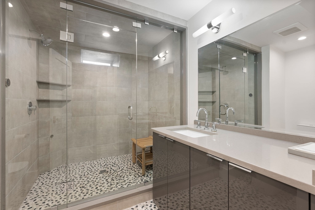 123 Abbott Road Wellesley, MA 02481 - Photo 36 of 42 a bathroom with a sink shower and a mirror