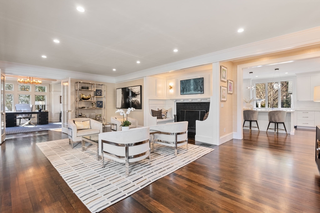 123 Abbott Road Wellesley, MA 02481 - Photo 4 of 42 a living room with fireplace furniture and a wooden floor