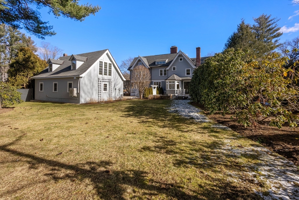 123 Abbott Road Wellesley, MA 02481 - Photo 41 of 42 a view of a big house with a big yard and large tree
