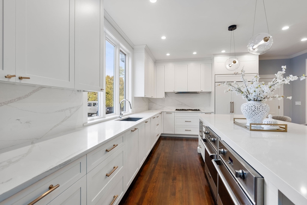 123 Abbott Road Wellesley, MA 02481 - Photo 9 of 42 a kitchen with a sink stove and cabinets