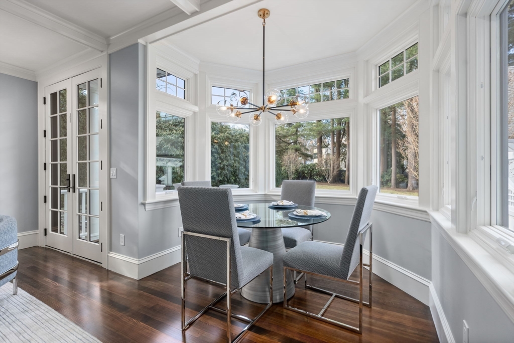 123 Abbott Road Wellesley, MA 02481 - Photo 10 of 42 a dining room with furniture a chandelier and wooden floor