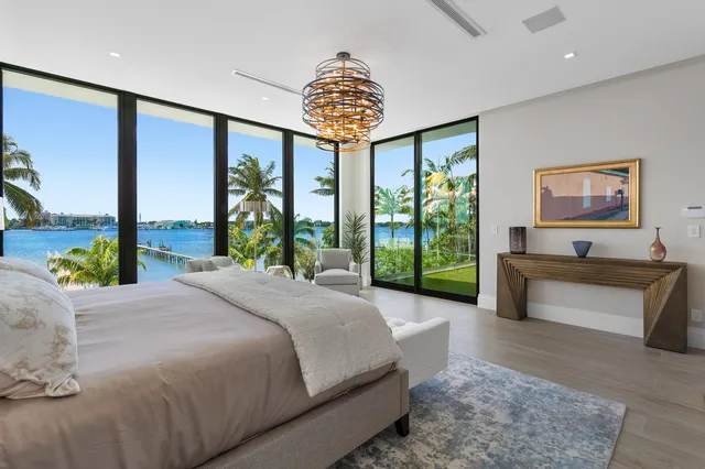 a spacious bathroom with a double vanity sink mirror and bathtub