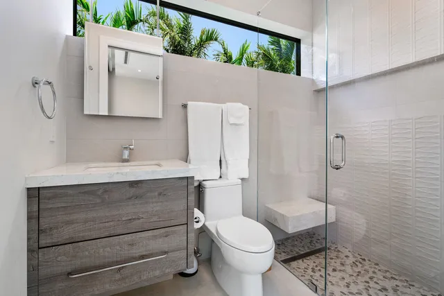 a view of swimming pool with outdoor seating and plants