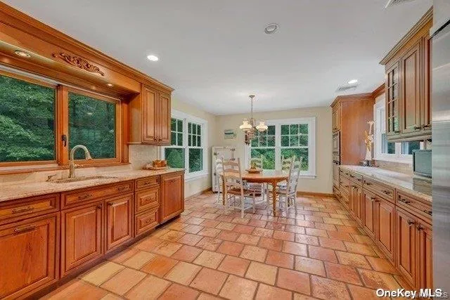 a large kitchen with a large window