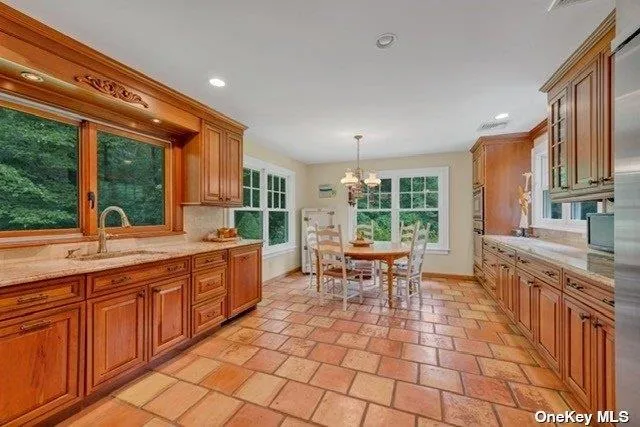 a large kitchen with a large window