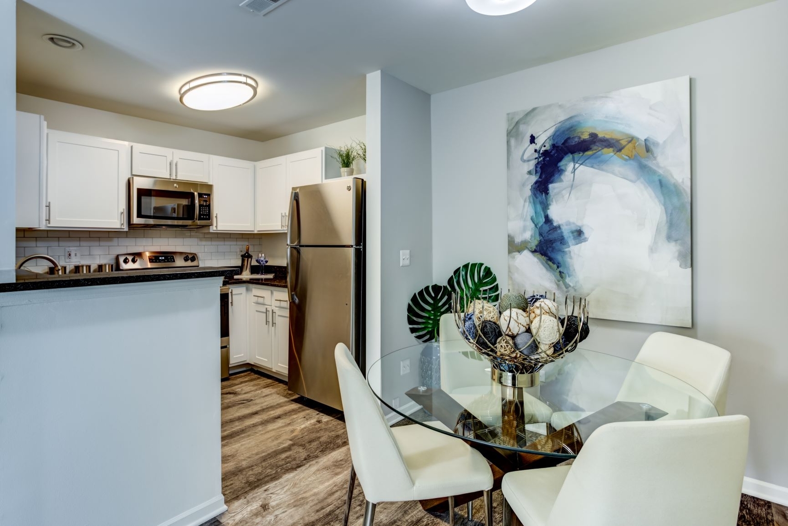 425 Chopin Court, Unit 425 Wheaton, IL 60189 - Photo 29 of 61 a dining room with furniture a chandelier and kitchen view