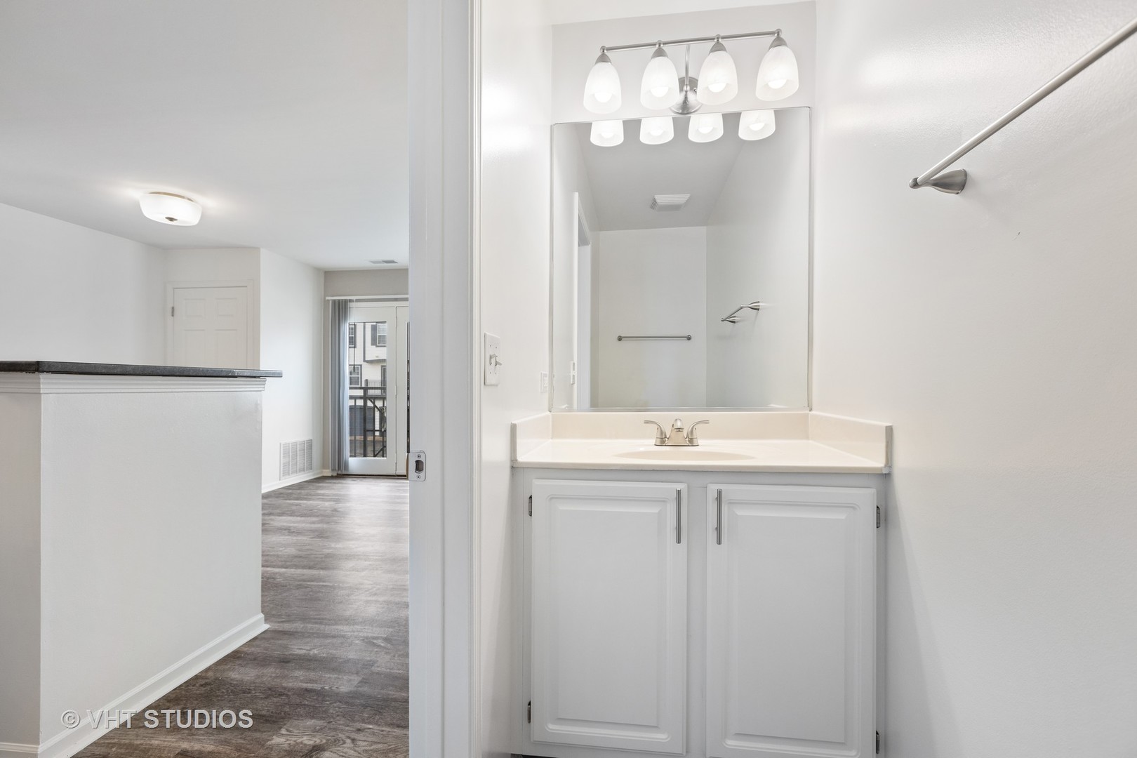 425 Chopin Court, Unit 425 Wheaton, IL 60189 - Photo 56 of 61 a bathroom with a sink and mirror