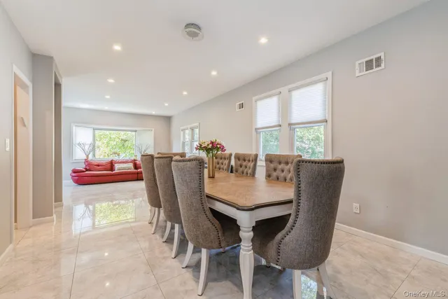 a view of a dining room with furniture window and outside view
