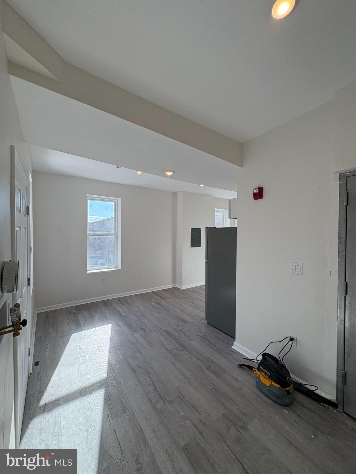 3625 North 22nd Street, Unit 2 Philadelphia, PA 19140 - Photo 3 of 10 a view of empty room with wooden floor