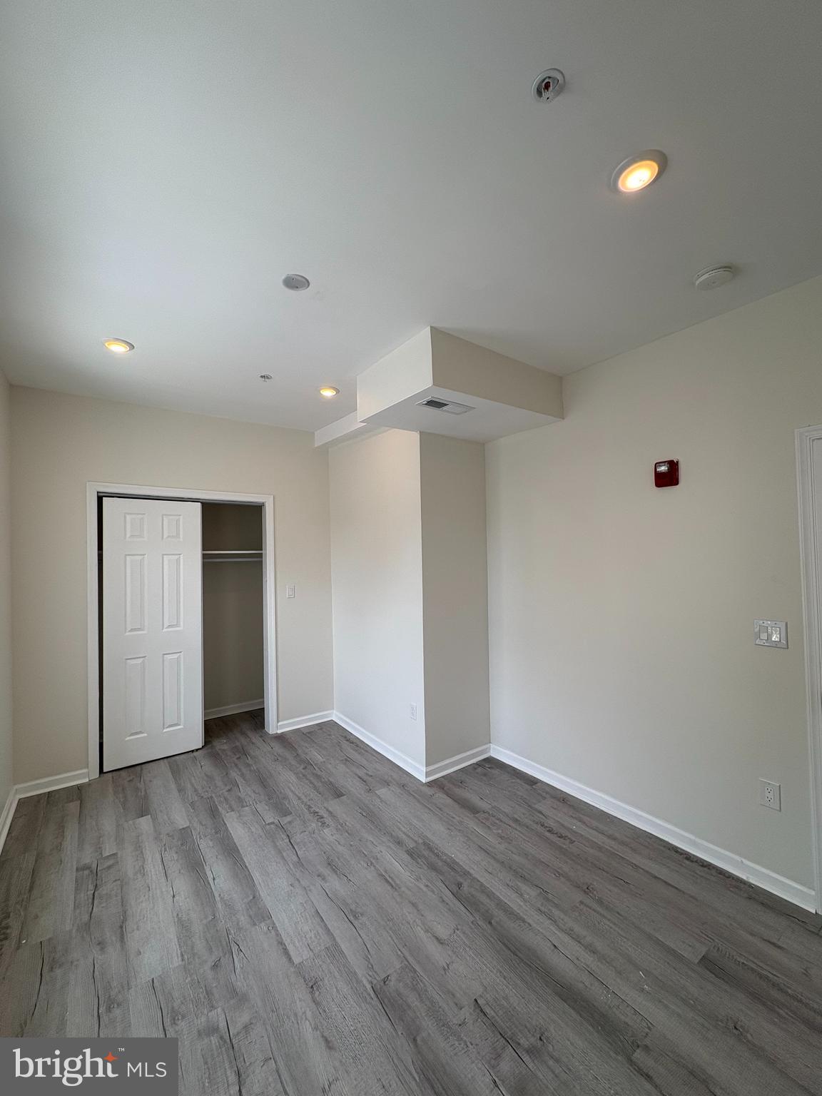 3625 North 22nd Street, Unit 2 Philadelphia, PA 19140 - Photo 8 of 10 a view of an empty room with wooden floor