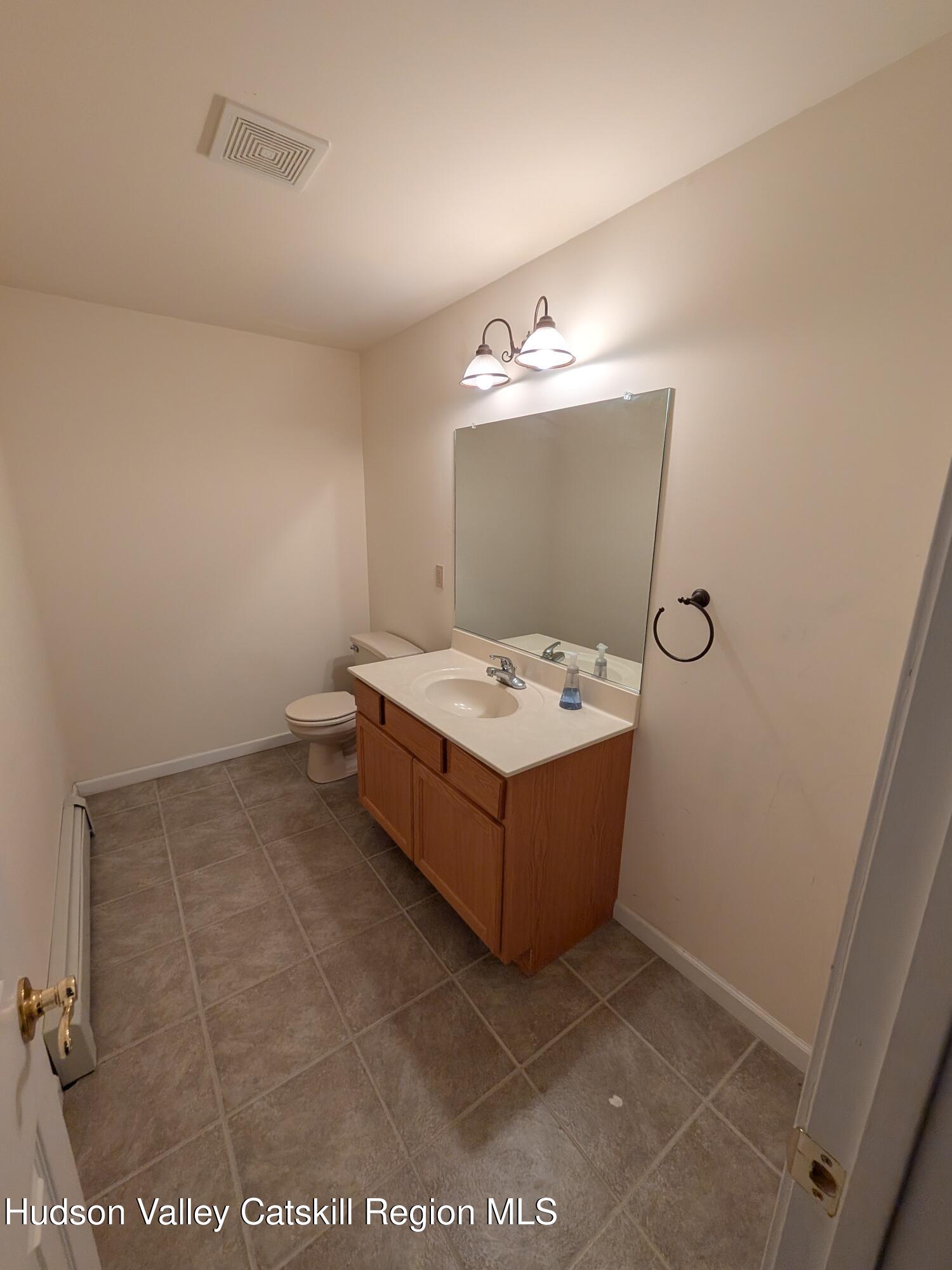 513 South Mountain Road Gardiner, NY 12525 - Photo 28 of 63 a bathroom with a tub sink and mirror
