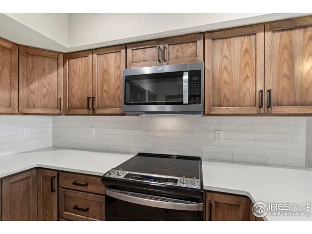 a kitchen with a stove and a microwave
