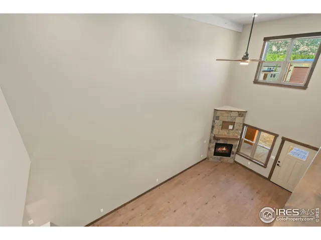 a view of room with hardwood floor and window