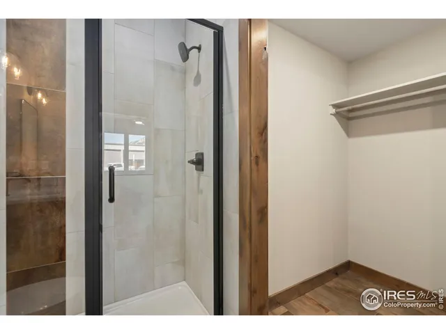 a bathroom with a shower and a sink