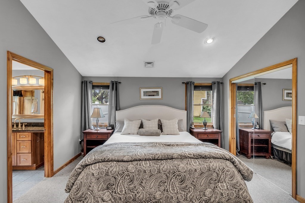 5 Colby Road Danvers, MA 01923 - Photo 16 of 33 a bedroom with a large bed and a chandelier