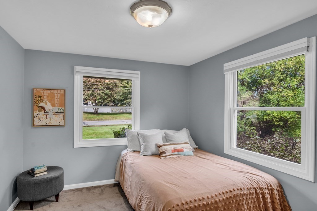 5 Colby Road Danvers, MA 01923 - Photo 19 of 33 a bedroom with a bed and a window