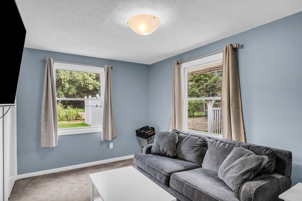 5 Colby Road Danvers, MA 01923 - Photo 22 of 33 a living room with furniture and a window