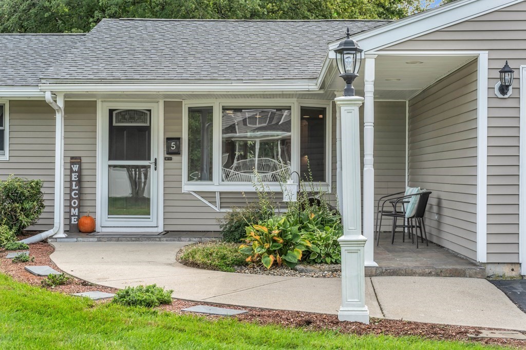 5 Colby Road Danvers, MA 01923 - Photo 3 of 33 a front view of a house with garden