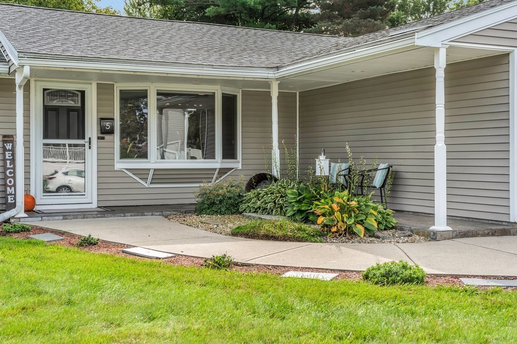 5 Colby Road Danvers, MA 01923 - Photo 4 of 33 a front view of a house with garden