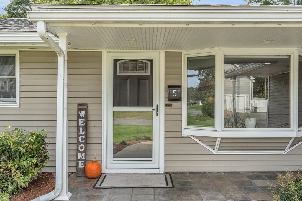 5 Colby Road Danvers, MA 01923 - Photo 5 of 33 a front view of a house with a porch