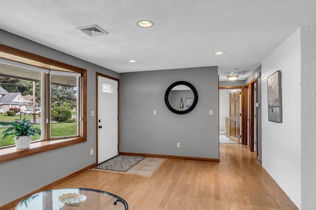 5 Colby Road Danvers, MA 01923 - Photo 7 of 33 a view of a livingroom with furniture window wooden floor and front door