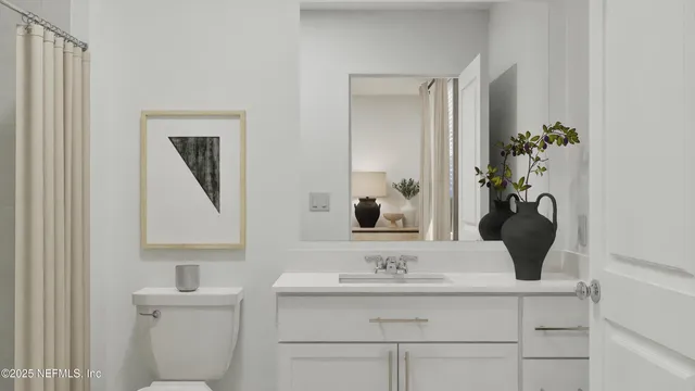 a bathroom with a sink a toilet and mirror