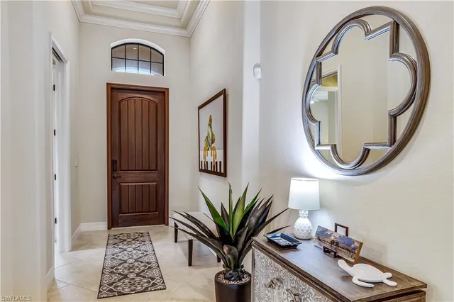a view of living room with furniture and a mirror