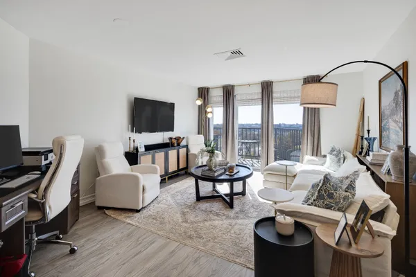 a living room with furniture and a flat screen tv or window