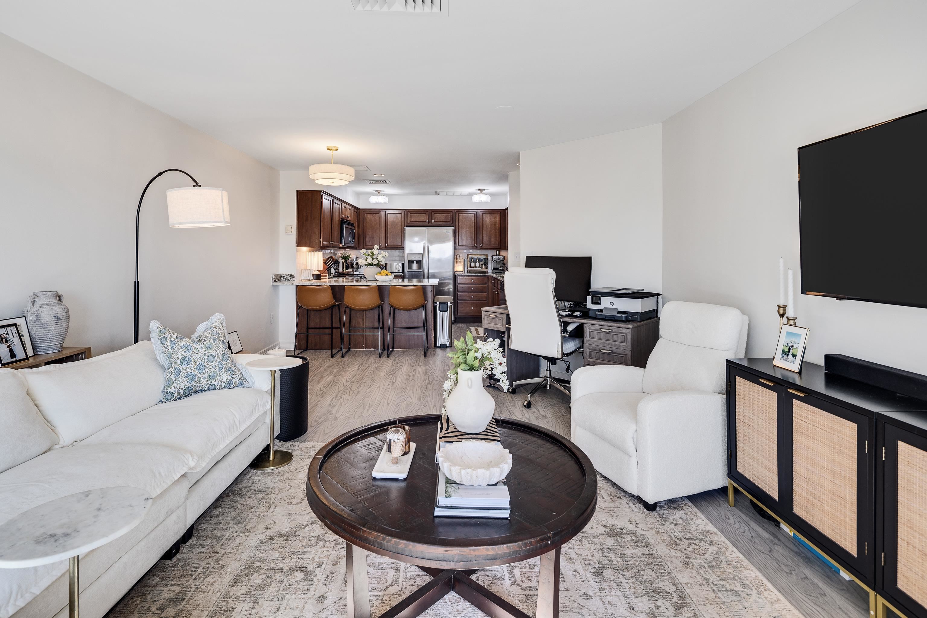 655 Riverside Drive, Unit 708A Memphis, TN 38103 - Photo 12 of 30 a living room with furniture a rug and a flat screen tv