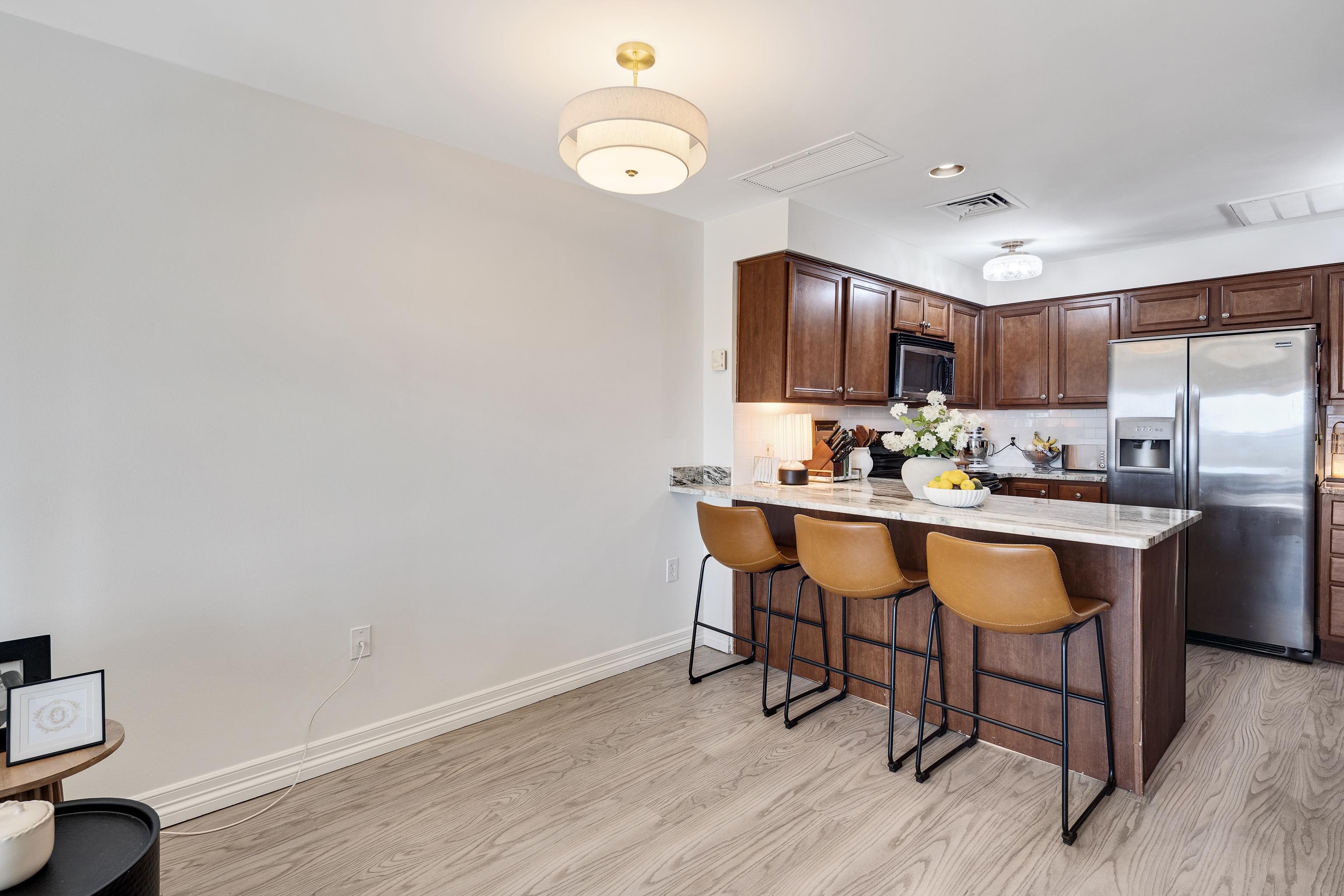 655 Riverside Drive, Unit 708A Memphis, TN 38103 - Photo 13 of 30 a kitchen with a sink cabinets and wooden floor