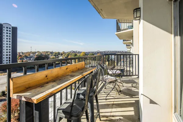 a view of balcony with furniture