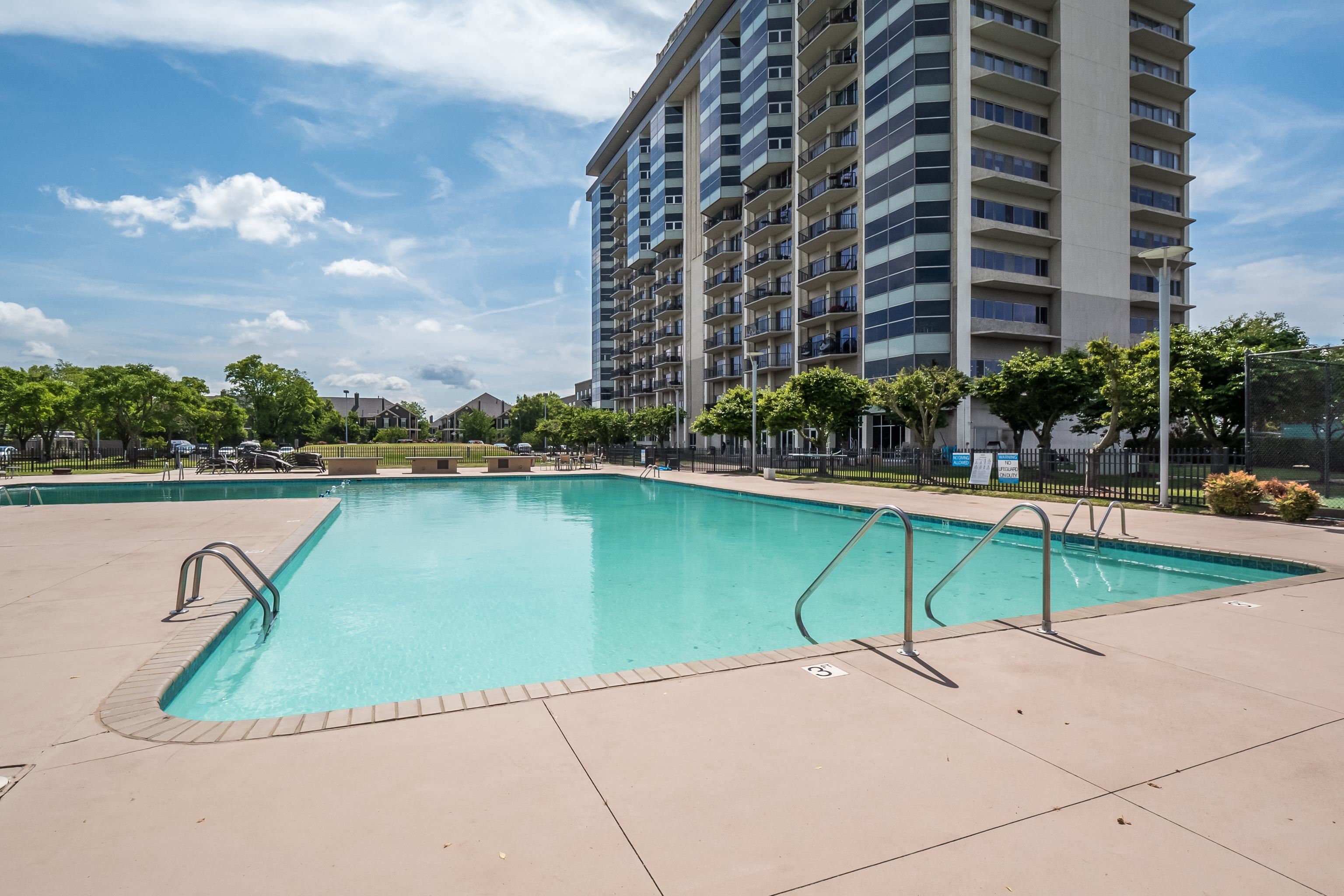 655 Riverside Drive, Unit 708A Memphis, TN 38103 - Photo 25 of 30 a view of swimming pool outdoor seating and lake