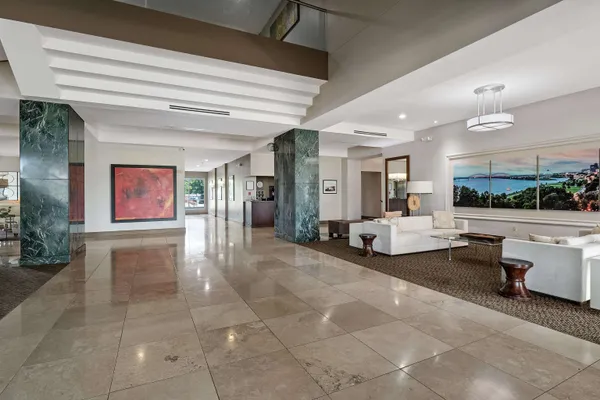 a lobby with furniture and window