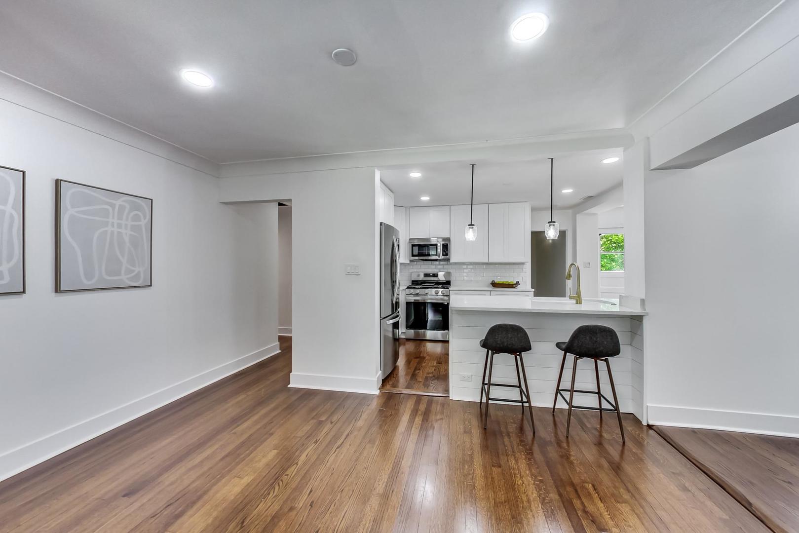 1211 West Talcott Road Park Ridge, IL 60068 - Photo 11 of 57 a view of a living room with wooden floor and a window