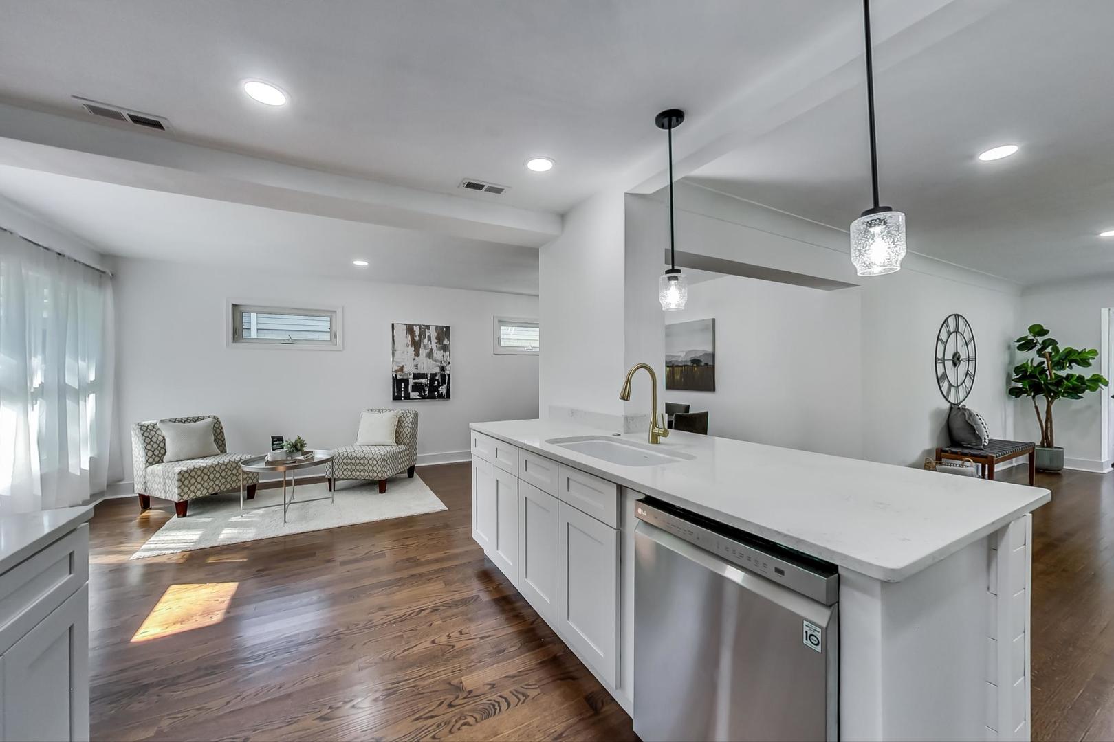 1211 West Talcott Road Park Ridge, IL 60068 - Photo 16 of 57 a large kitchen with kitchen island a large island in it