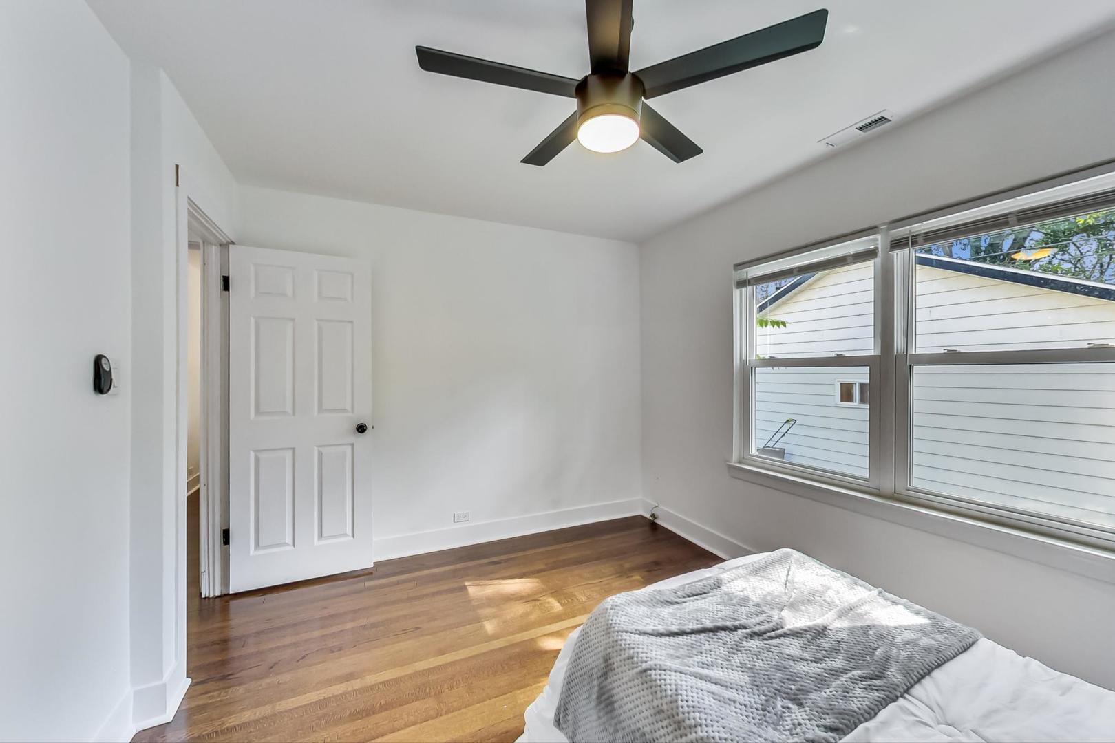 1211 West Talcott Road Park Ridge, IL 60068 - Photo 28 of 57 a view of a bedroom with wooden floor and windows