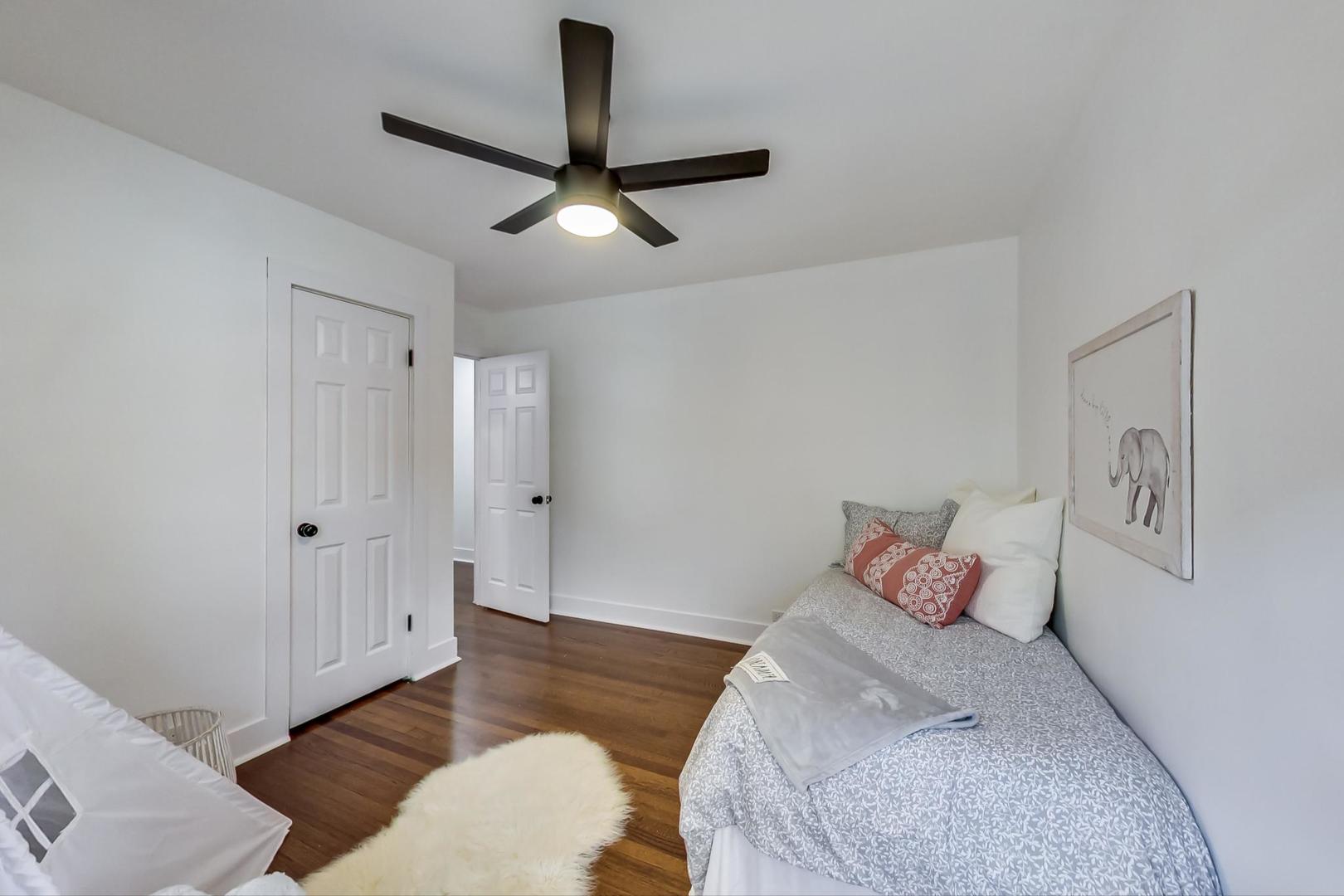 1211 West Talcott Road Park Ridge, IL 60068 - Photo 30 of 57 a bedroom with a bed and a couch