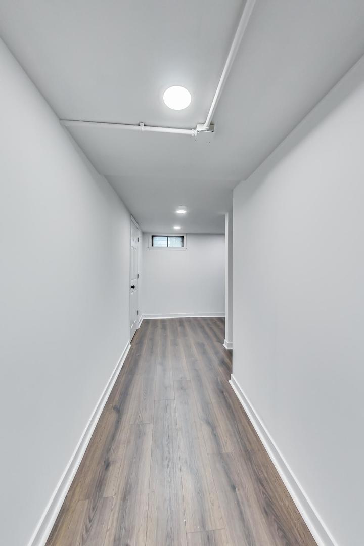 1211 West Talcott Road Park Ridge, IL 60068 - Photo 32 of 57 a view of a big room with wooden floor and windows