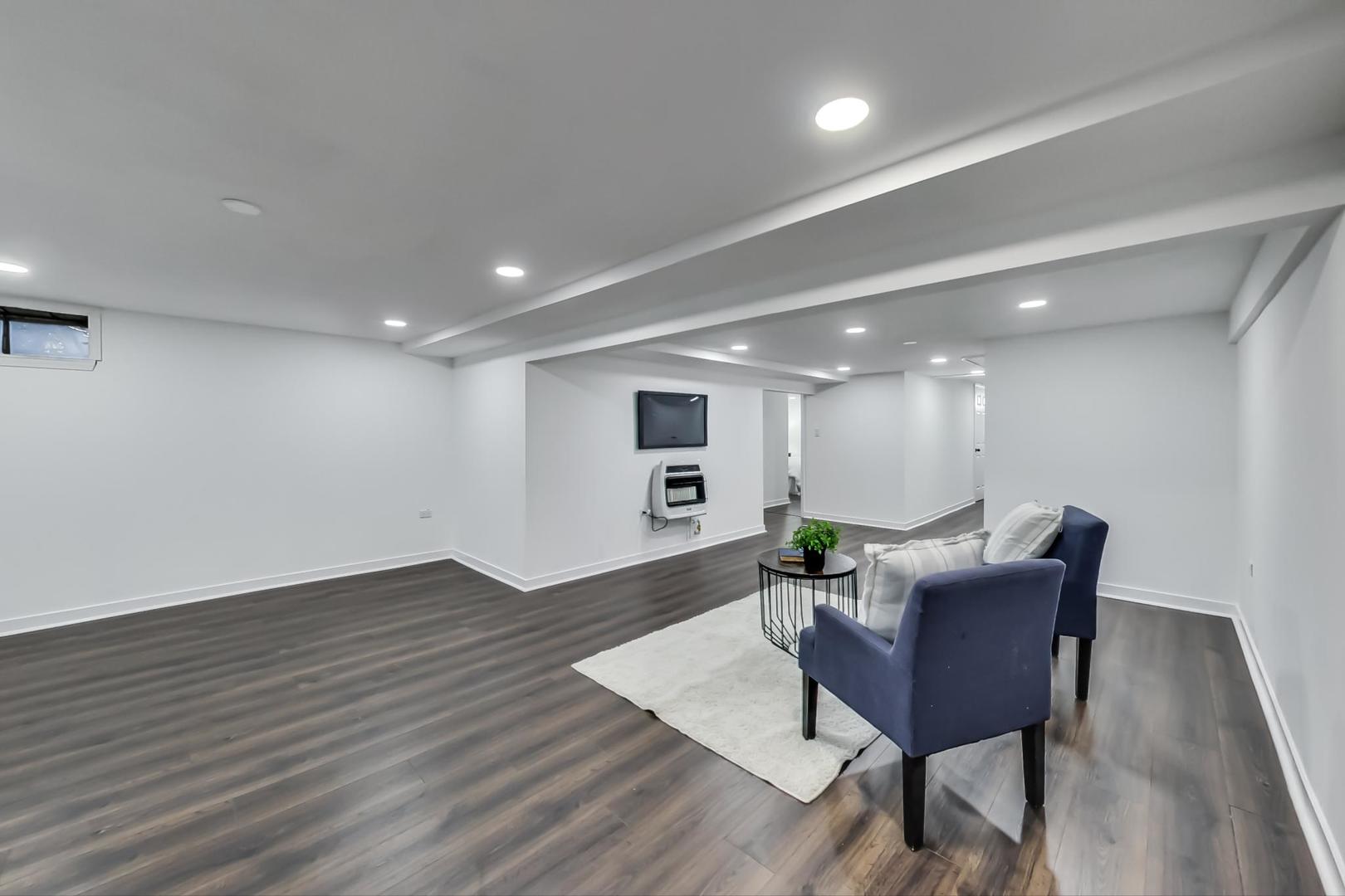 1211 West Talcott Road Park Ridge, IL 60068 - Photo 34 of 57 a workspace with furniture and wooden floor