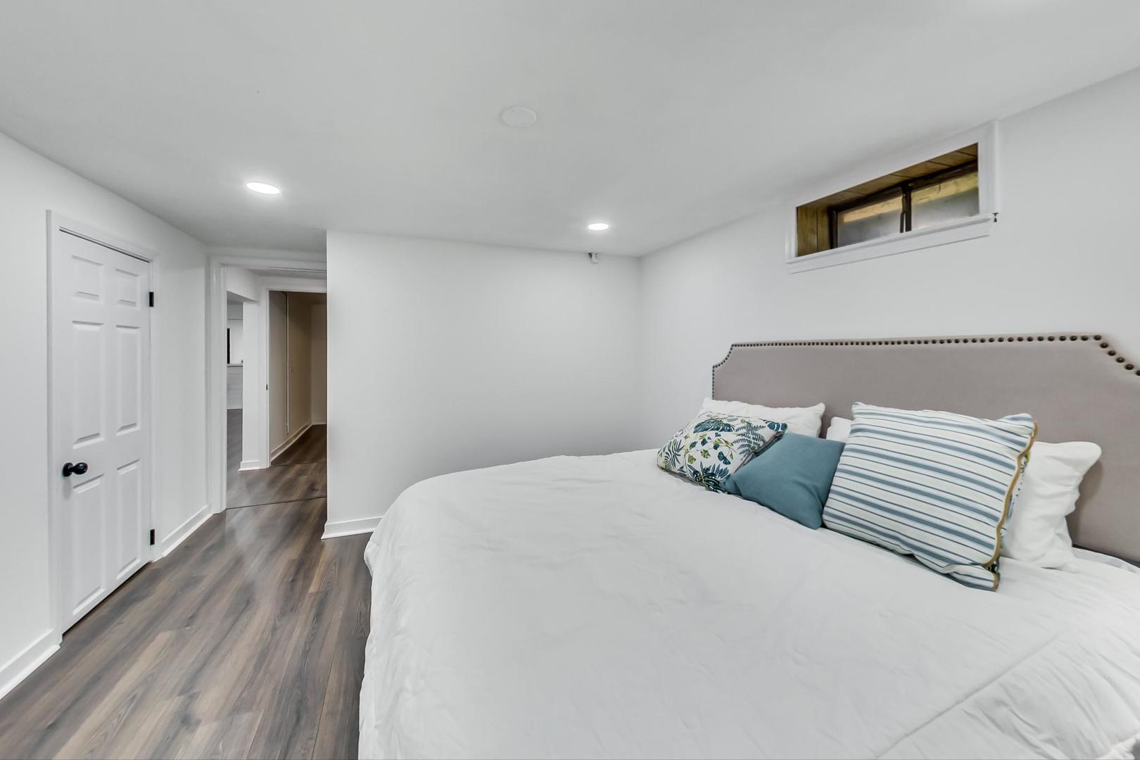 1211 West Talcott Road Park Ridge, IL 60068 - Photo 41 of 57 a bedroom with a bed and a night stand