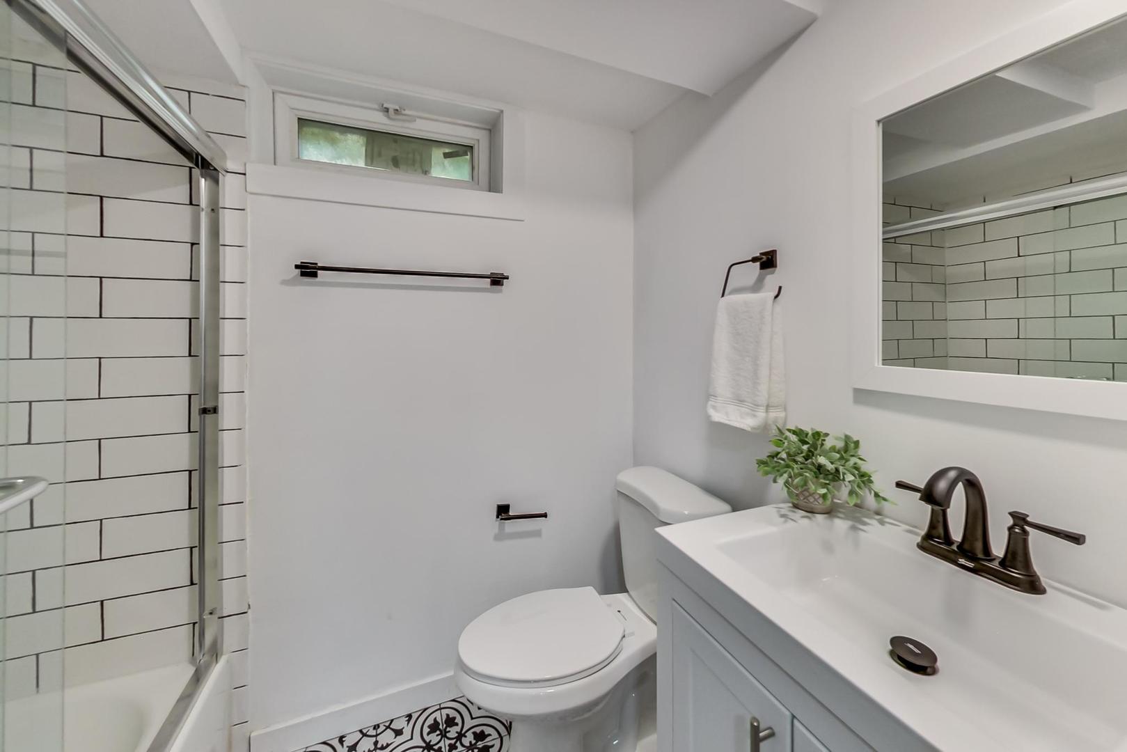 1211 West Talcott Road Park Ridge, IL 60068 - Photo 43 of 57 a bathroom with a sink a toilet and shower