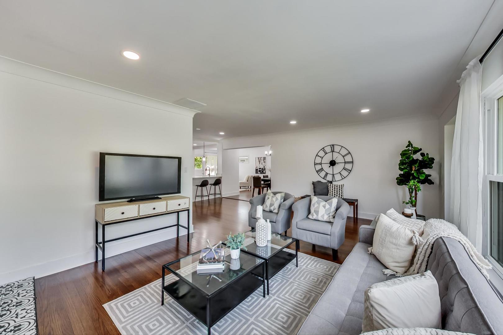 1211 West Talcott Road Park Ridge, IL 60068 - Photo 8 of 57 a living room with furniture and a flat screen tv