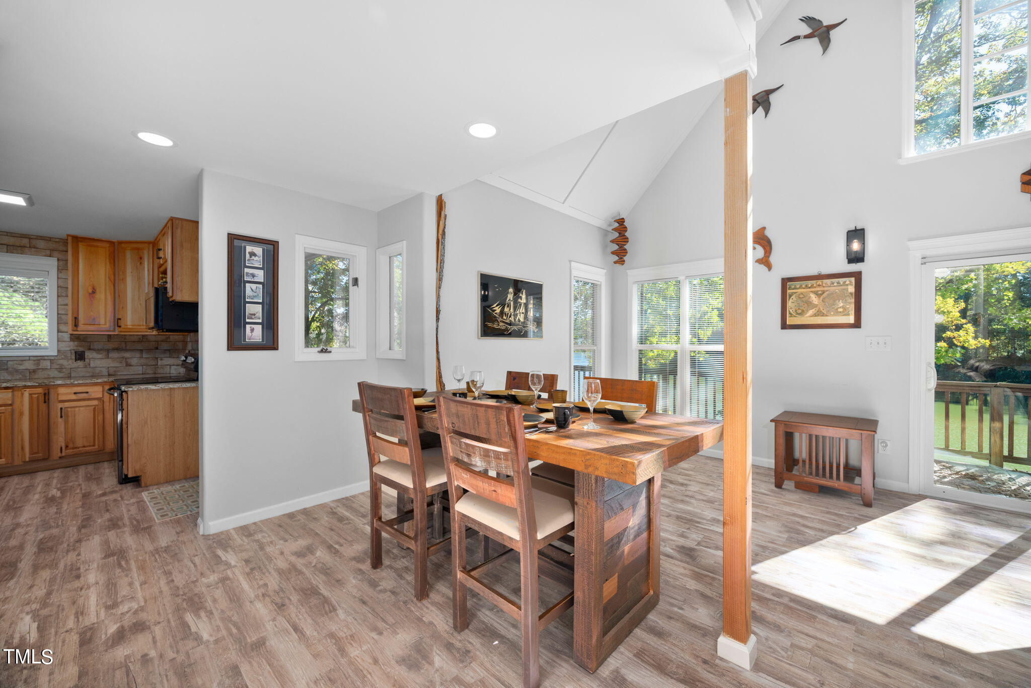 427 Mason Road Durham, NC 27712 - Photo 8 of 29 a view of a dining room with furniture window and wooden floor