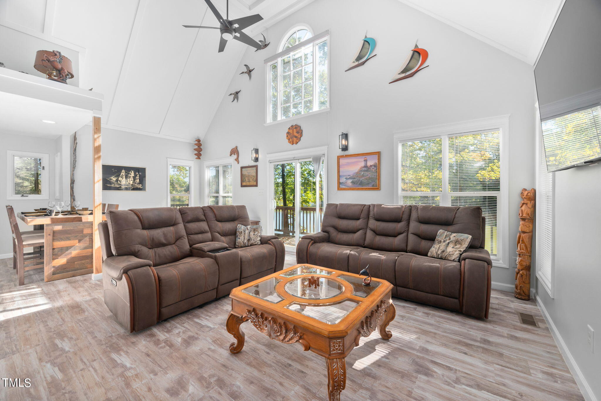 427 Mason Road Durham, NC 27712 - Photo 9 of 29 a living room with furniture a large window and a chandelier