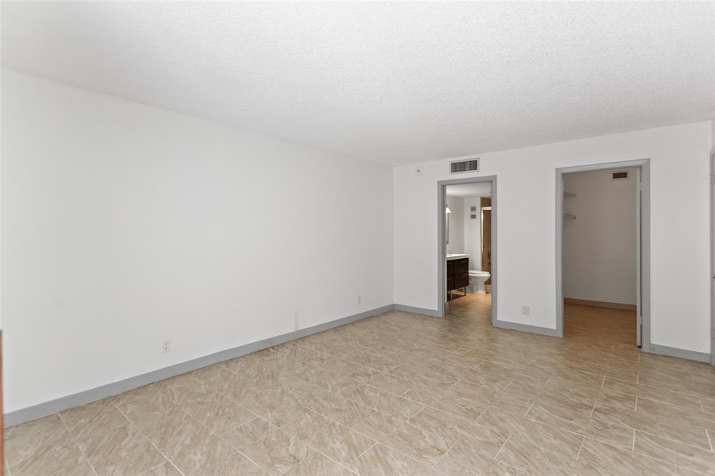 6300 Northwest 2nd Avenue, Unit 405 Boca Raton, FL 33487 - Photo 14 of 37 a view of an empty room and a window