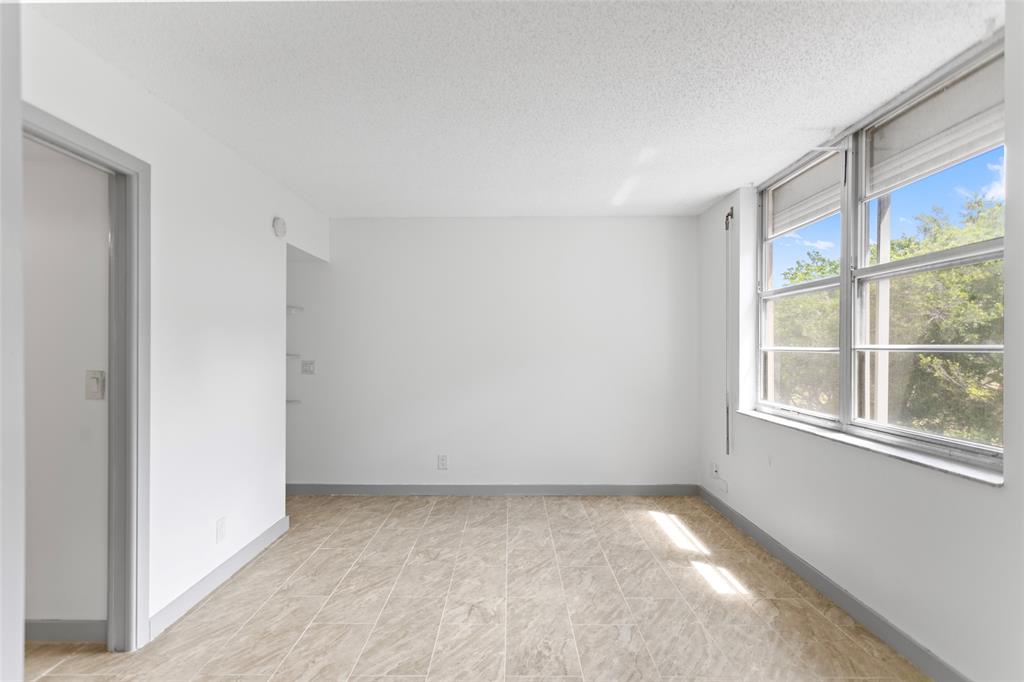 6300 Northwest 2nd Avenue, Unit 405 Boca Raton, FL 33487 - Photo 31 of 37 a view of an empty room with a window