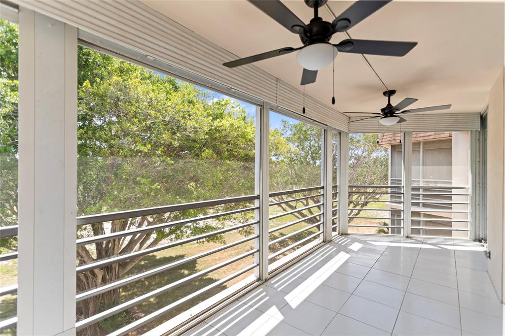 6300 Northwest 2nd Avenue, Unit 405 Boca Raton, FL 33487 - Photo 34 of 37 a view of a porch with wooden floor and city view
