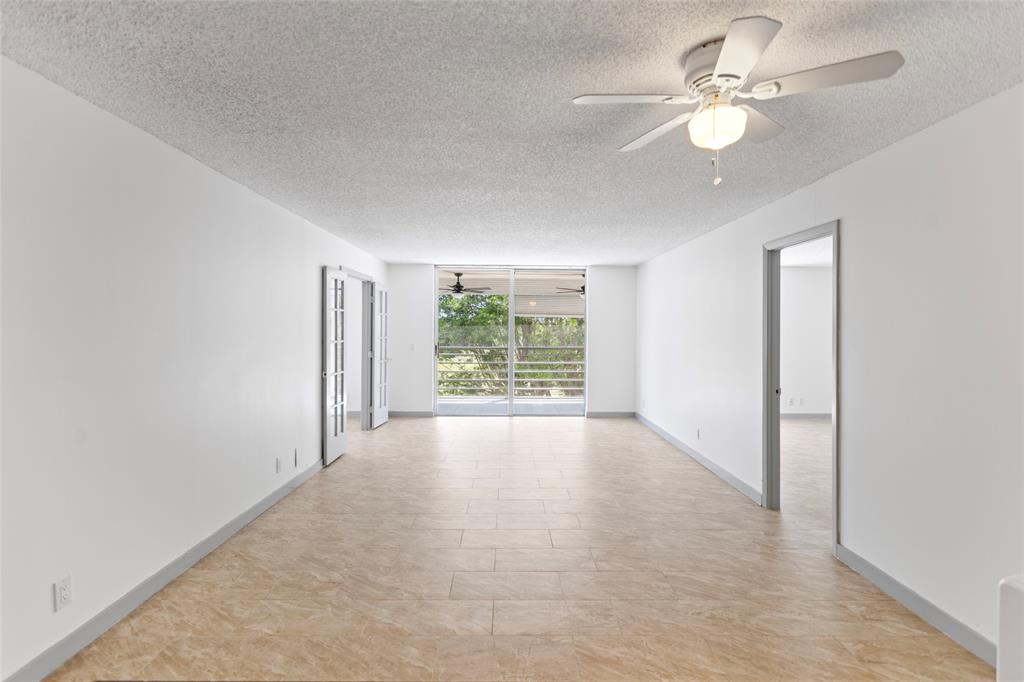6300 Northwest 2nd Avenue, Unit 405 Boca Raton, FL 33487 - Photo 5 of 37 wooden floor in an empty room with a window