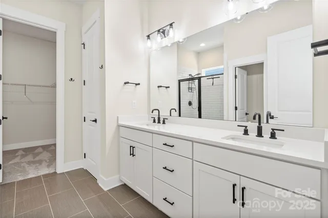 a bathroom with a double vanity sink mirror and double